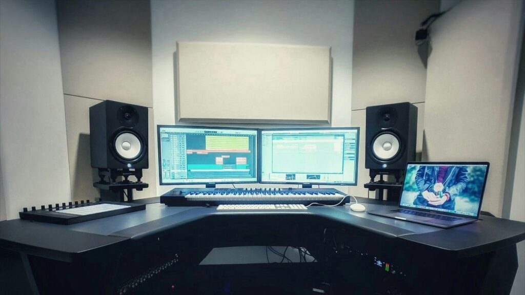 a computer desk with two monitors and a keyboard